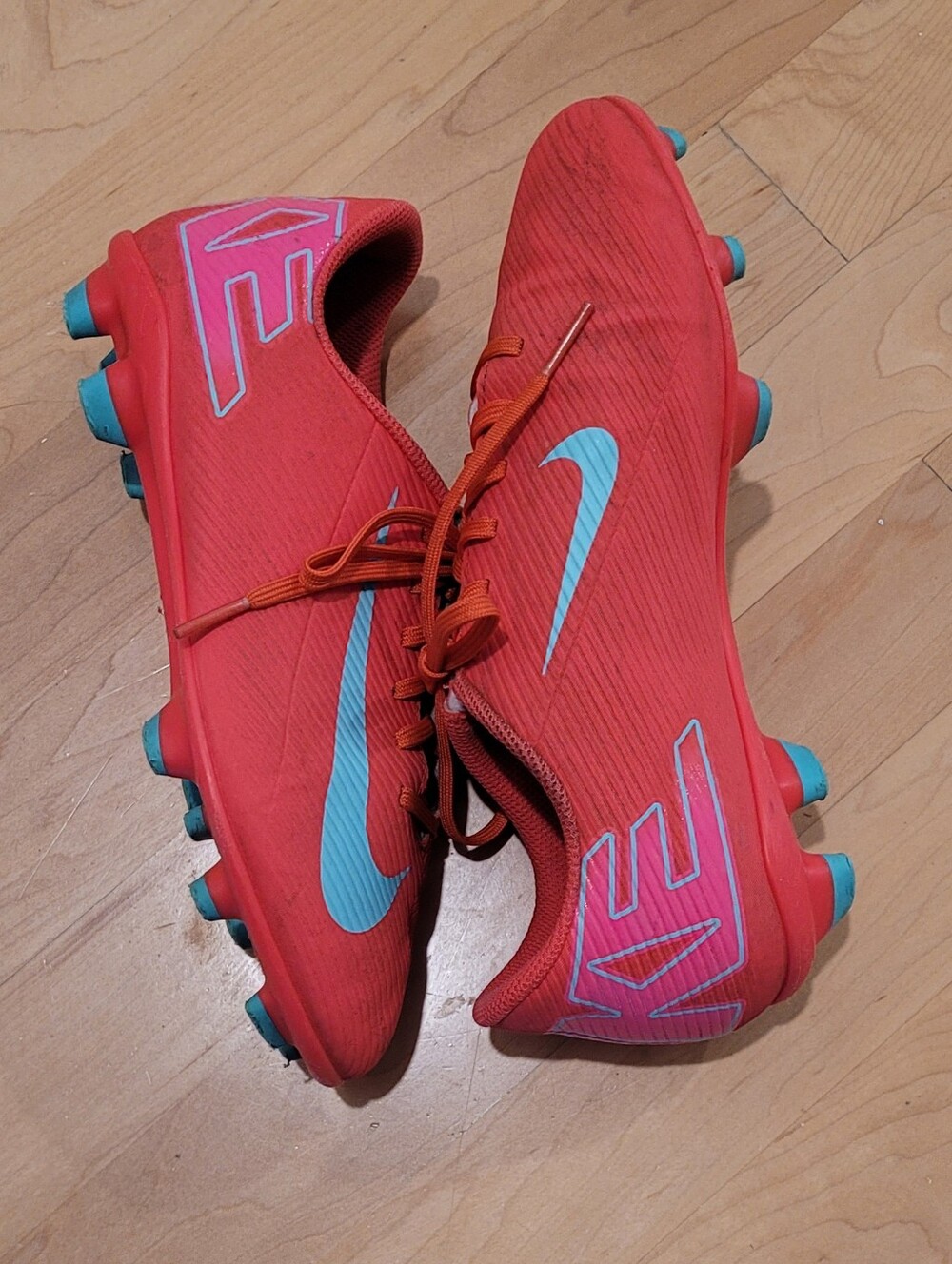 Nike Kids Coral Pink Soccer Cleats with Teal Swoosh Size 4